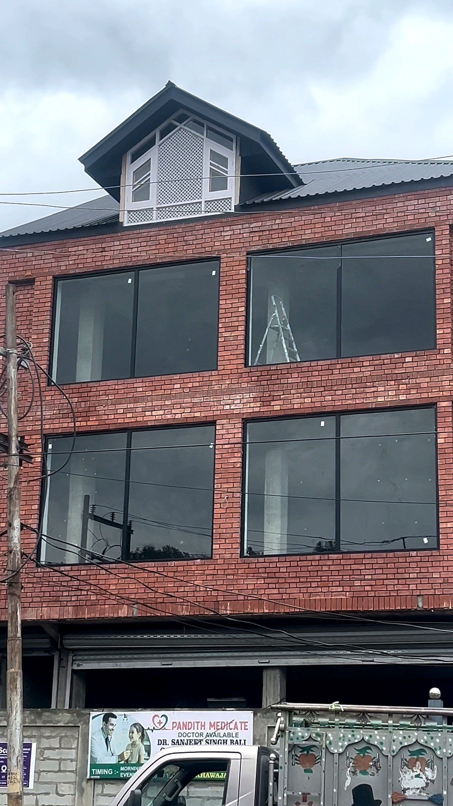 Brick building with dark uPVC windows
