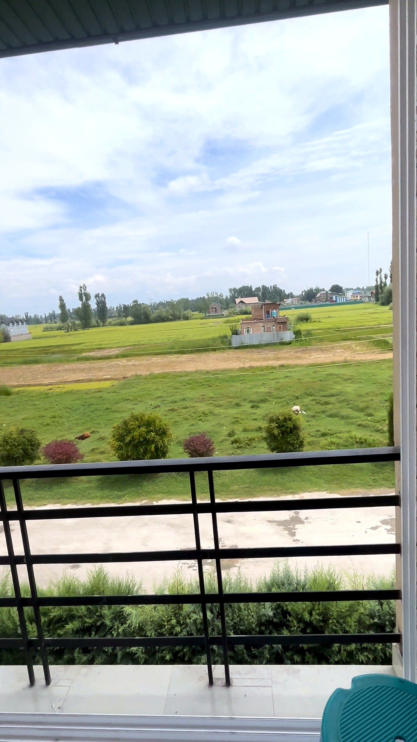 Balcony door looking over fields