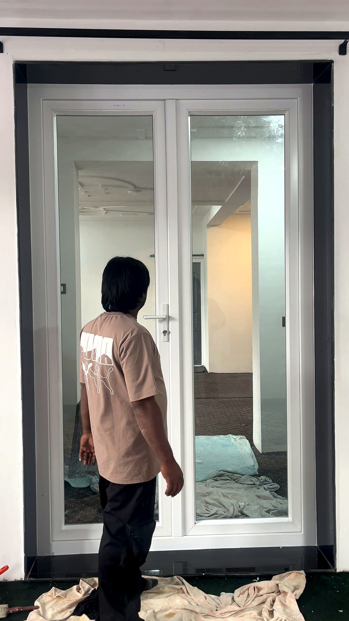 Pair of white uPVC French doors with one leaf open