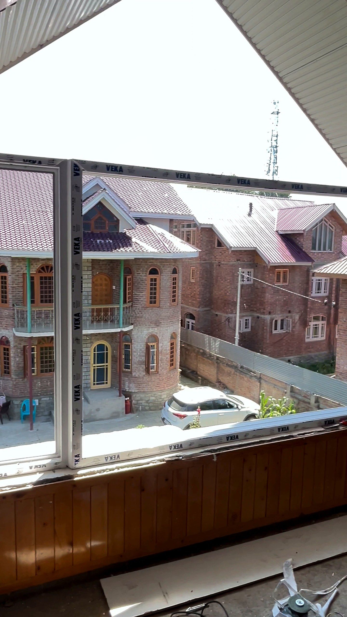 Gable room window looking at traditional brick houses