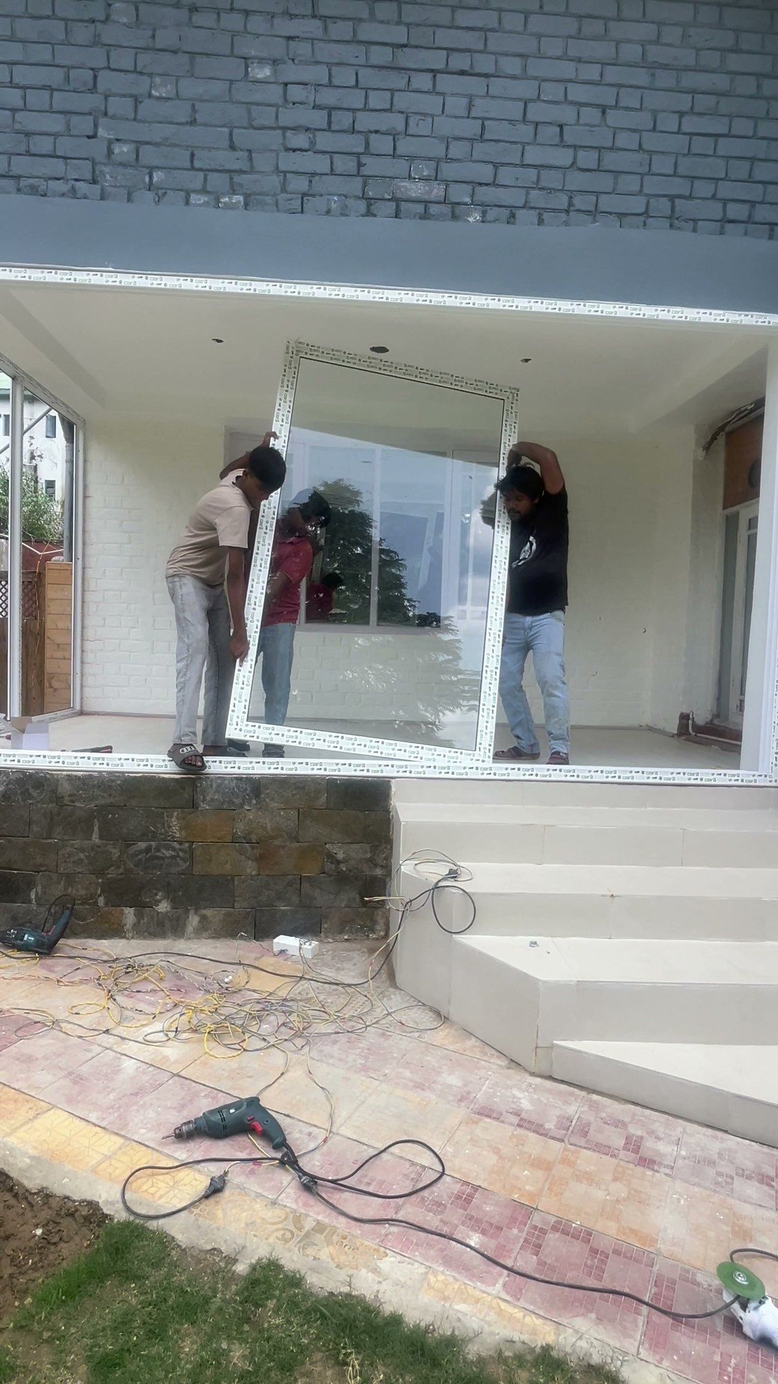 Installing large windows on a grey house