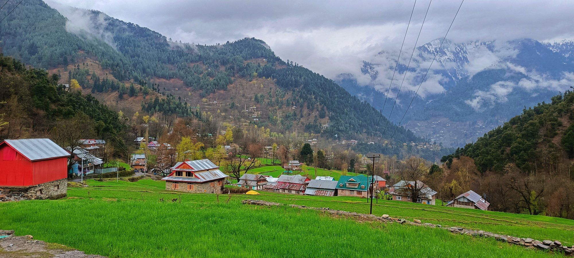 Village in Kupwara district with mountains behind