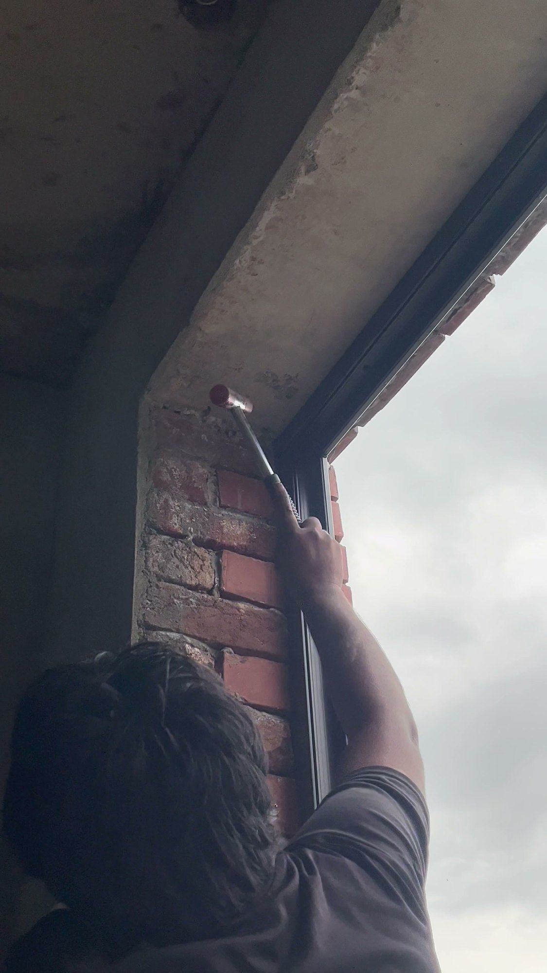 Fixing a dark frame into a new brick opening