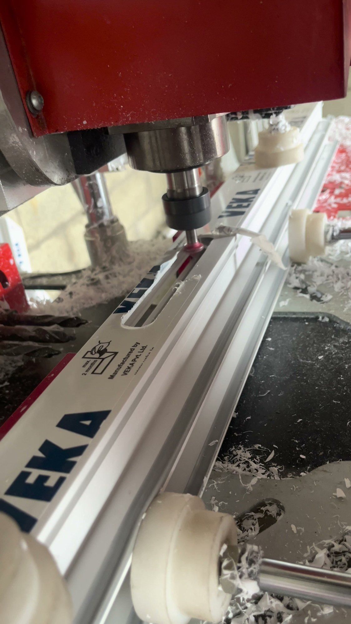 CNC router drilling a VEKA profile