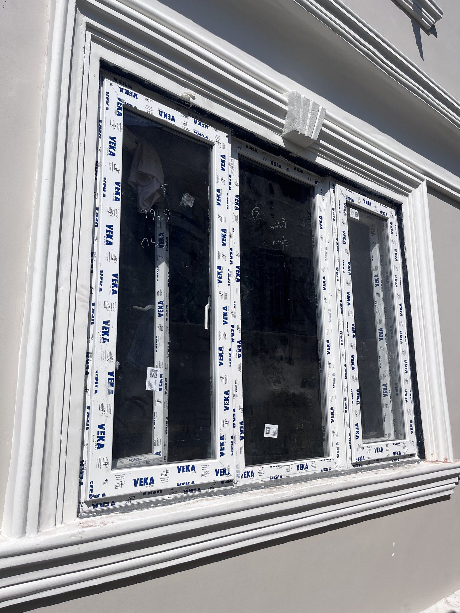 New VEKA uPVC window frames fitted in a plastered opening
