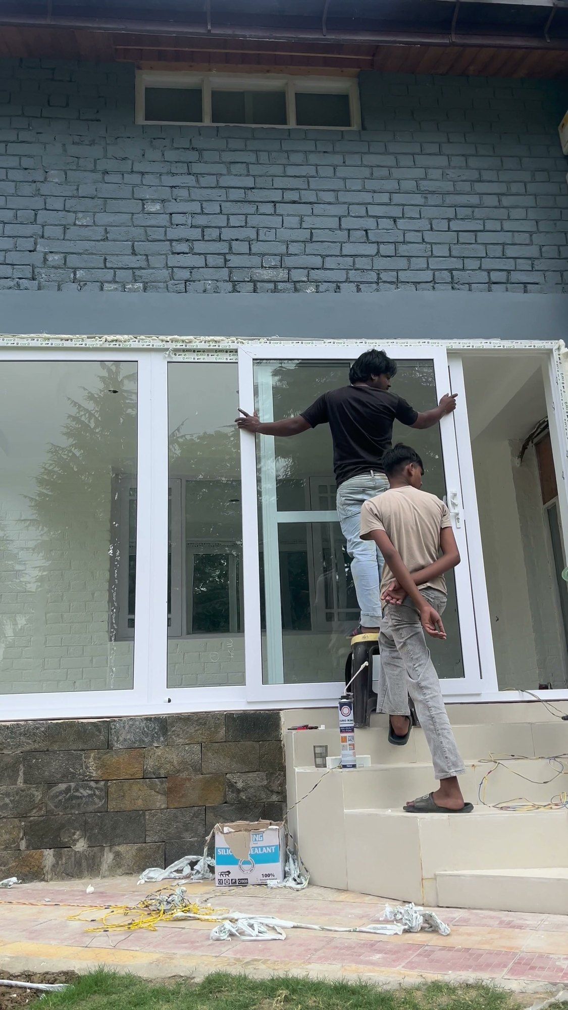 Standard Fabtech team installing large uPVC windows on a house in Kashmir