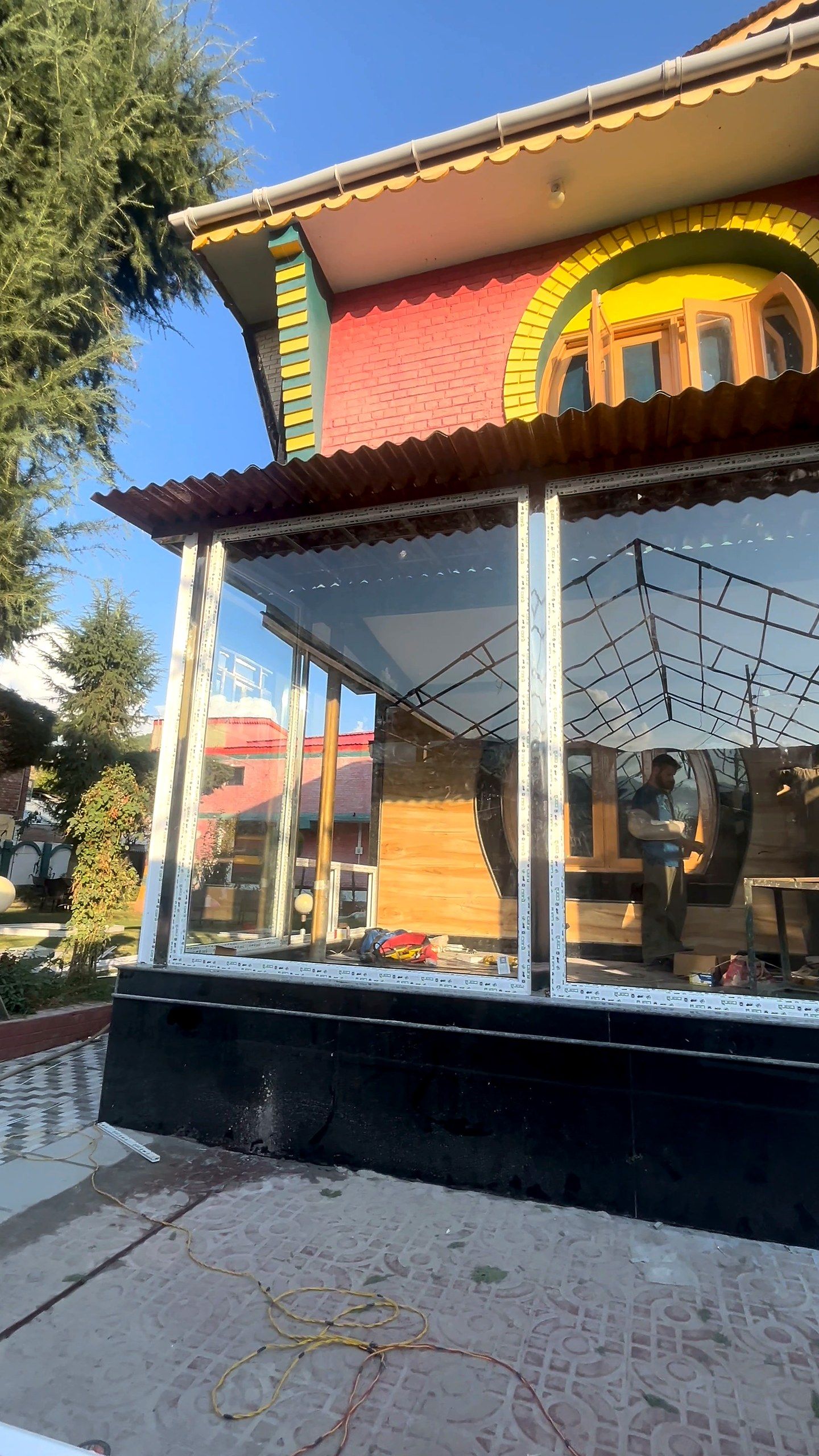 Front of a glazed veranda under a timber roof