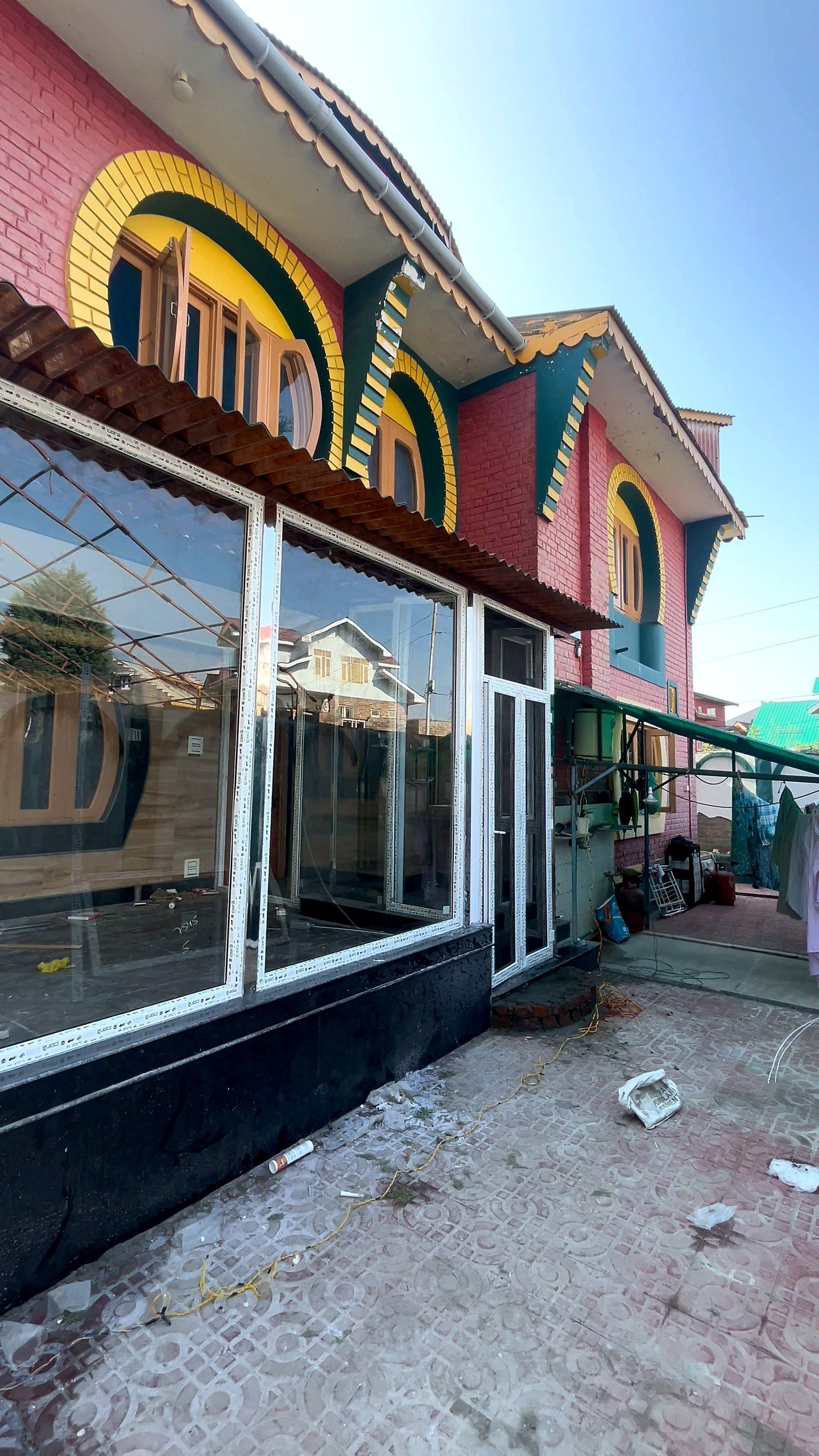 Long glazed veranda wrapping the front of a house